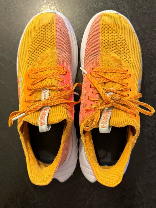 Hoka Shoes - Hoka Carbon X 3 sneakers in the Radiant Yellow and Camellia colorway.